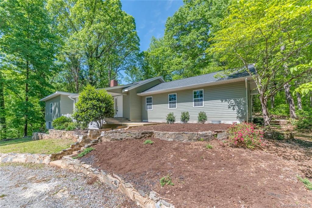 603 Vineyard Road Tryon, NC 28782 - Photo 32 of 39 a view of a house with backyard and a tree