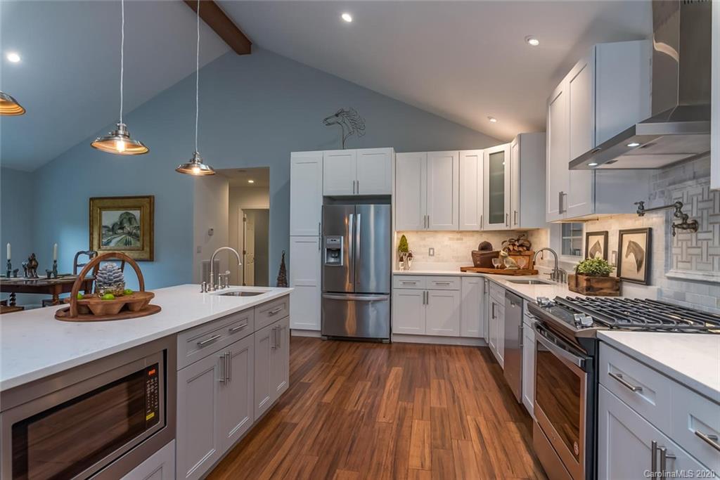 603 Vineyard Road Tryon, NC 28782 - Photo 10 of 39 a kitchen with a sink stove and refrigerator