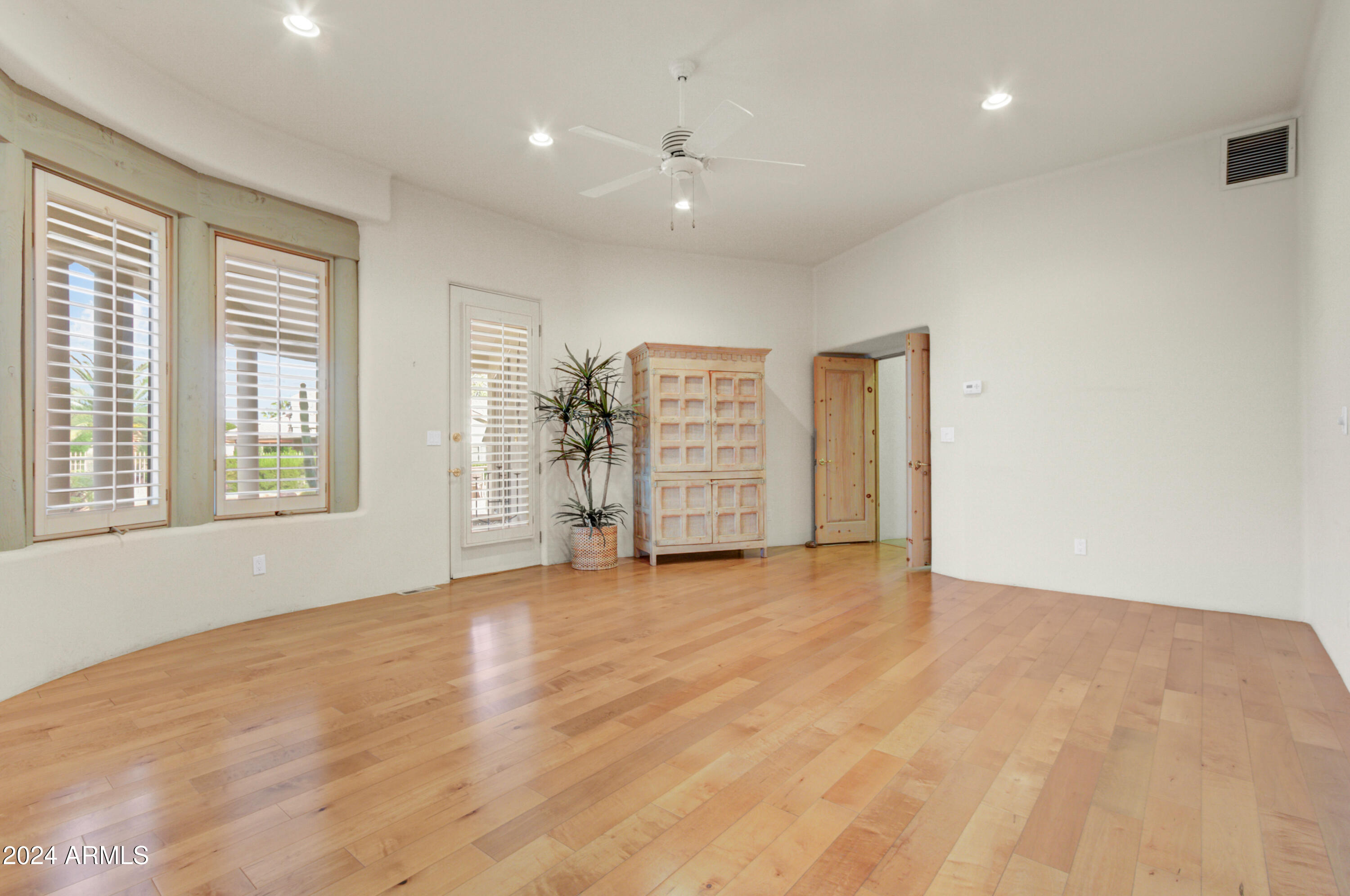 18830 East White Wing Drive Rio Verde, AZ 85263 - Photo 14 of 36 wooden floor in an empty room with a window