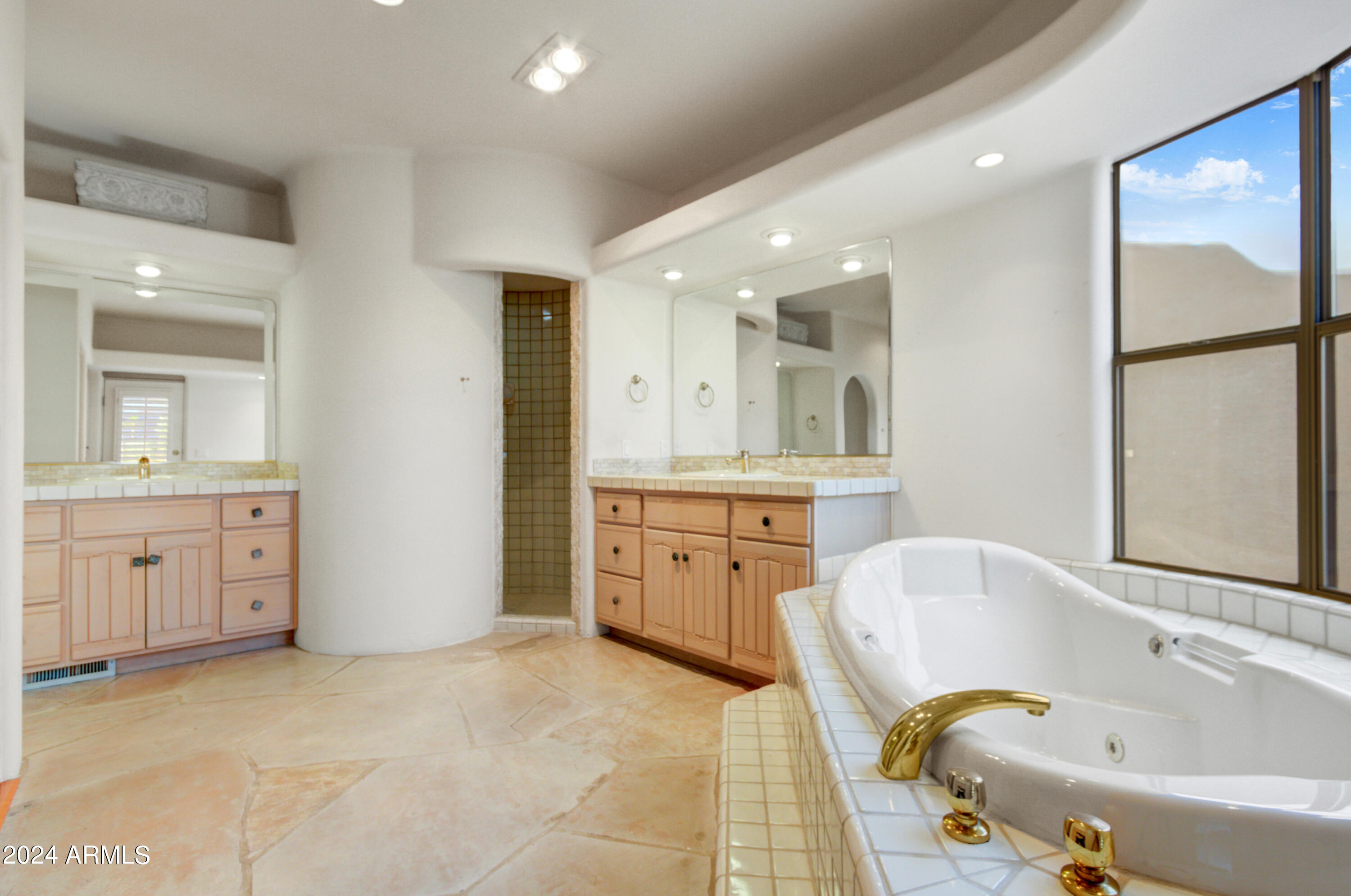 18830 East White Wing Drive Rio Verde, AZ 85263 - Photo 16 of 36 a bathroom with a granite countertop sink tub and mirror