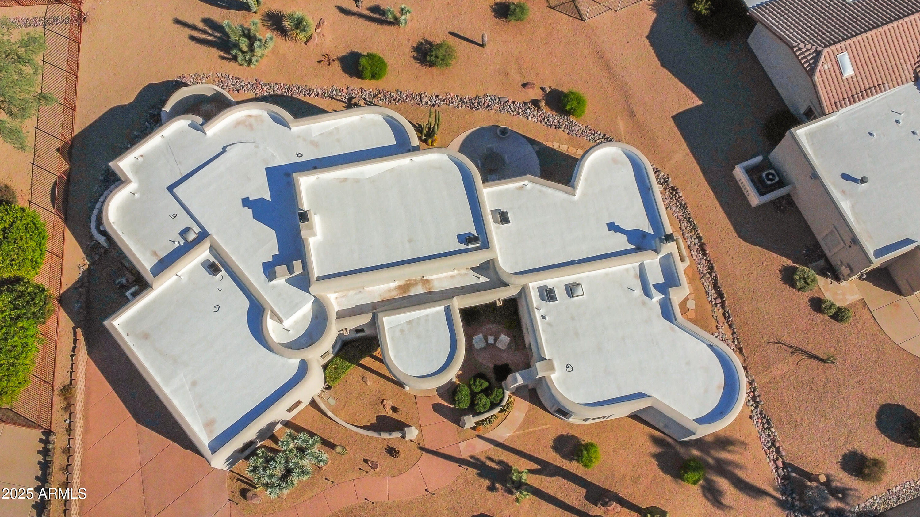 18830 East White Wing Drive Rio Verde, AZ 85263 - Photo 28 of 36 an aerial view of a backyard with table and chairs
