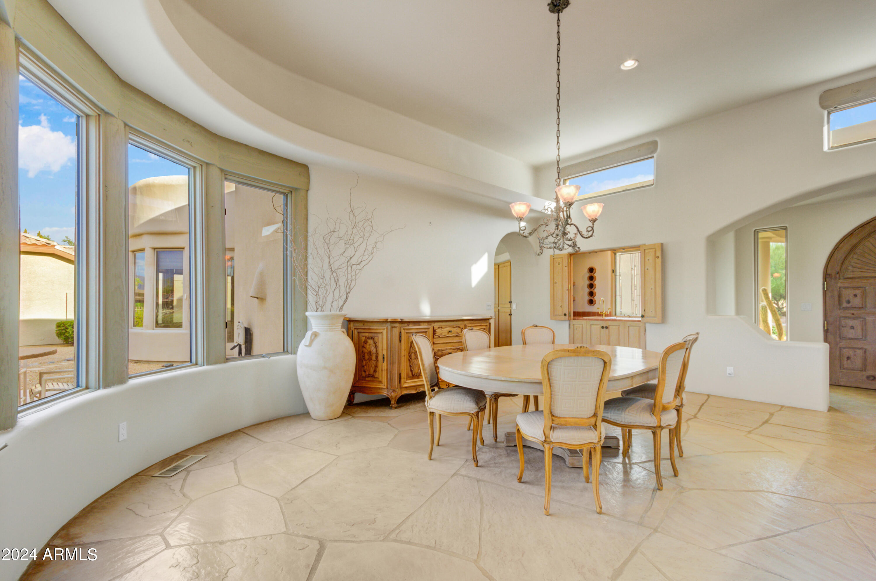 18830 East White Wing Drive Rio Verde, AZ 85263 - Photo 9 of 36 a view of a dining room with furniture window and wooden floor