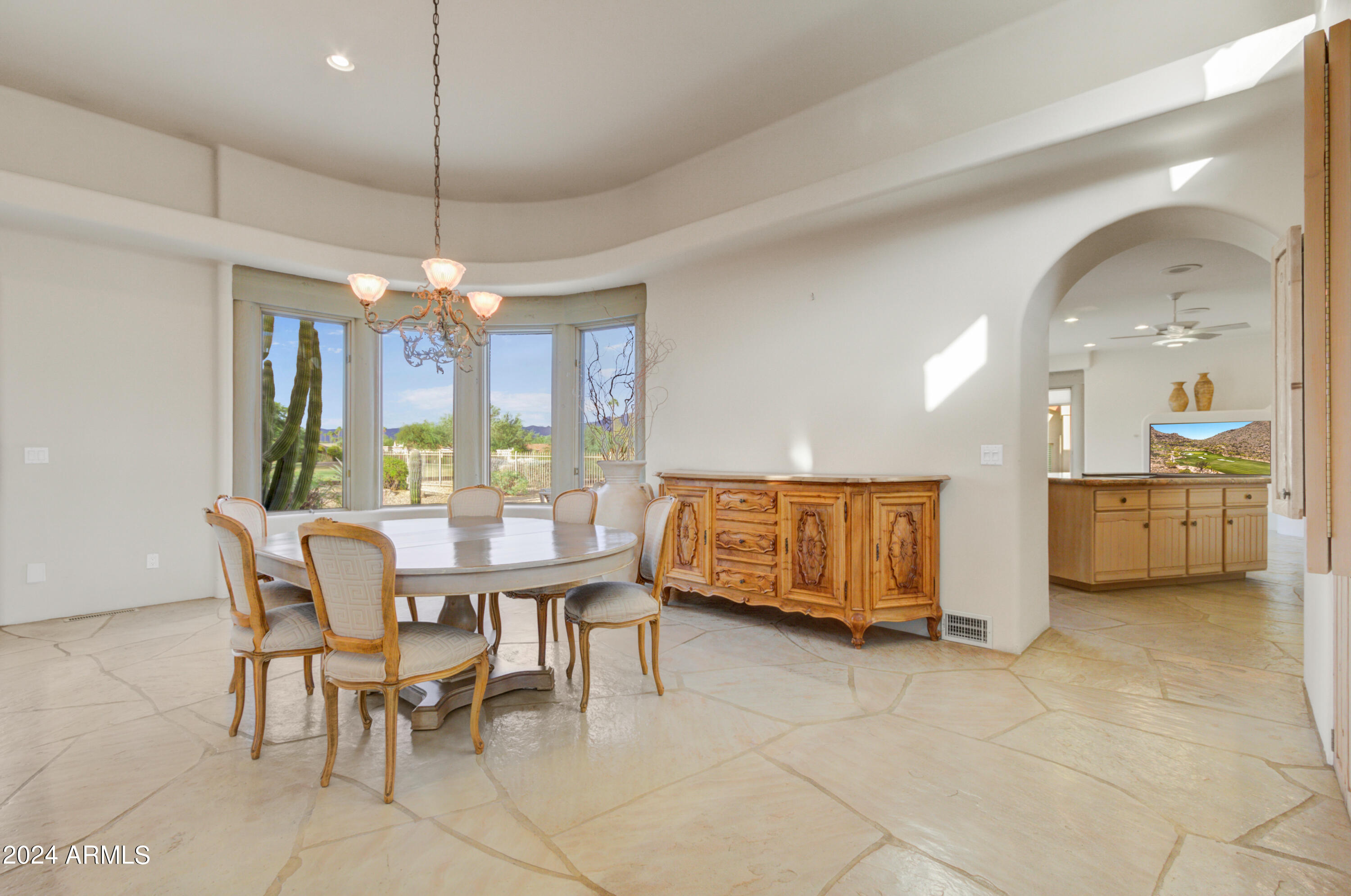 18830 East White Wing Drive Rio Verde, AZ 85263 - Photo 10 of 36 a view of a dining room with furniture and chandelier