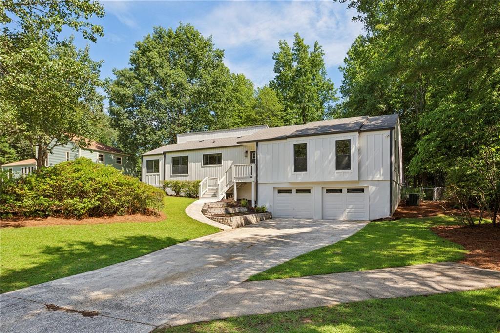 3447 Dry Creek Road Marietta, GA 30062 - Photo 2 of 42 a view of a house with backyard and sitting area