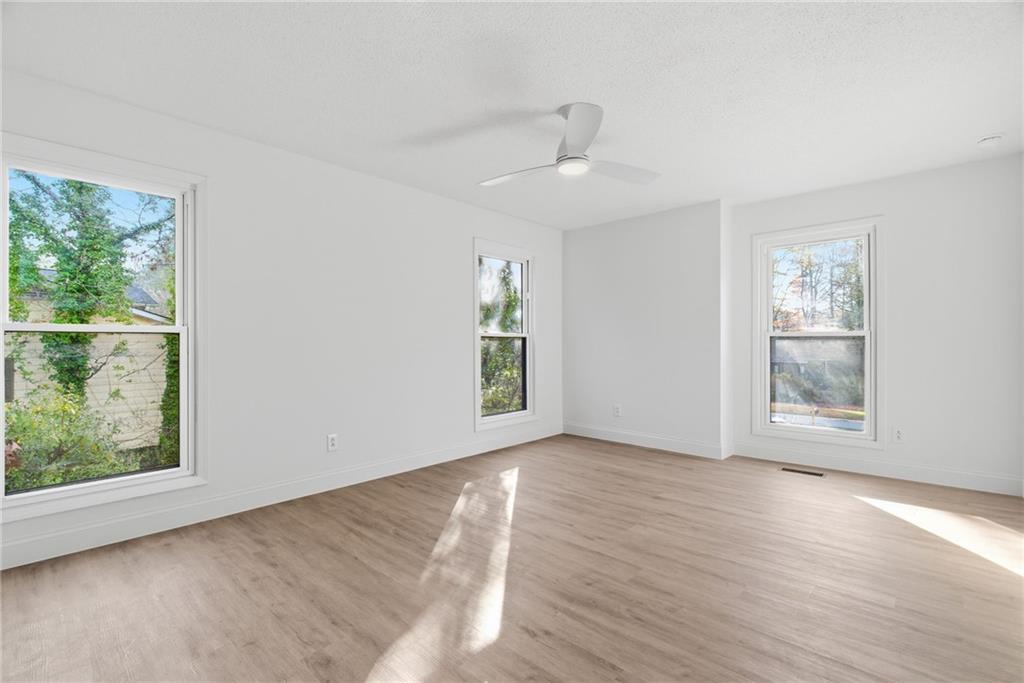 3447 Dry Creek Road Marietta, GA 30062 - Photo 25 of 42 wooden floor in an empty room with a window