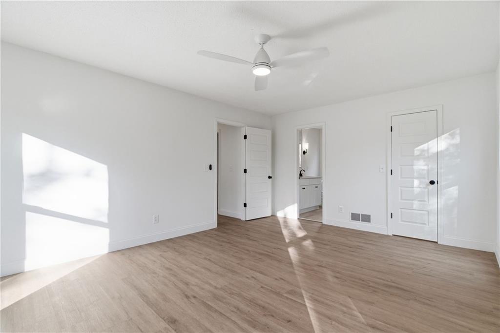 3447 Dry Creek Road Marietta, GA 30062 - Photo 27 of 42 a view of an empty room with wooden floor
