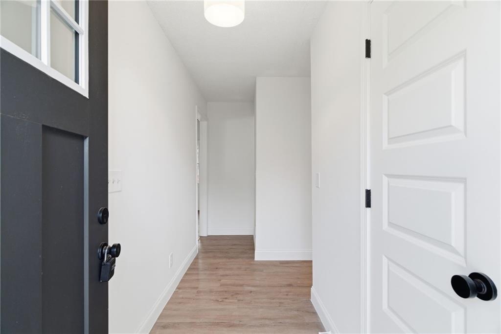 3447 Dry Creek Road Marietta, GA 30062 - Photo 4 of 42 a view of a hallway with wooden floor and cabinet