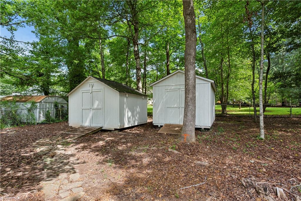 3447 Dry Creek Road Marietta, GA 30062 - Photo 41 of 42 a backyard of a house with lots of green space