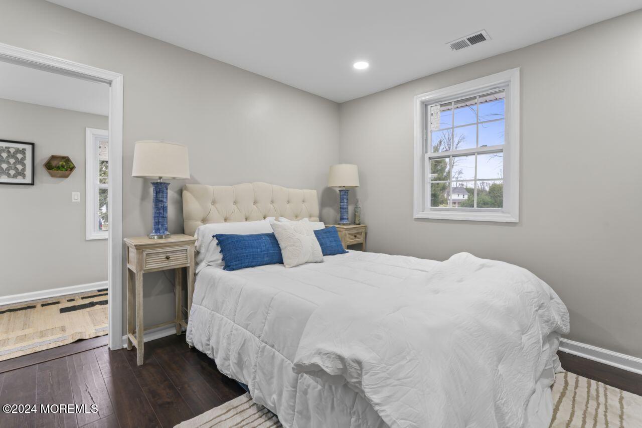 13 Texas Road Matawan, NJ 07747 - Photo 20 of 38 a bedroom with a large bed and a window