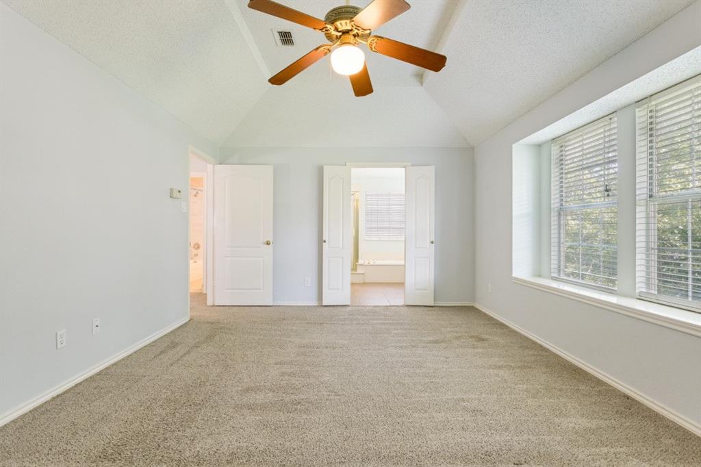 4709 Portrait Lane Plano, TX 75024 - Photo 15 of 22 Spacious primary retreat offering room for a sitting area and abundant natural light.