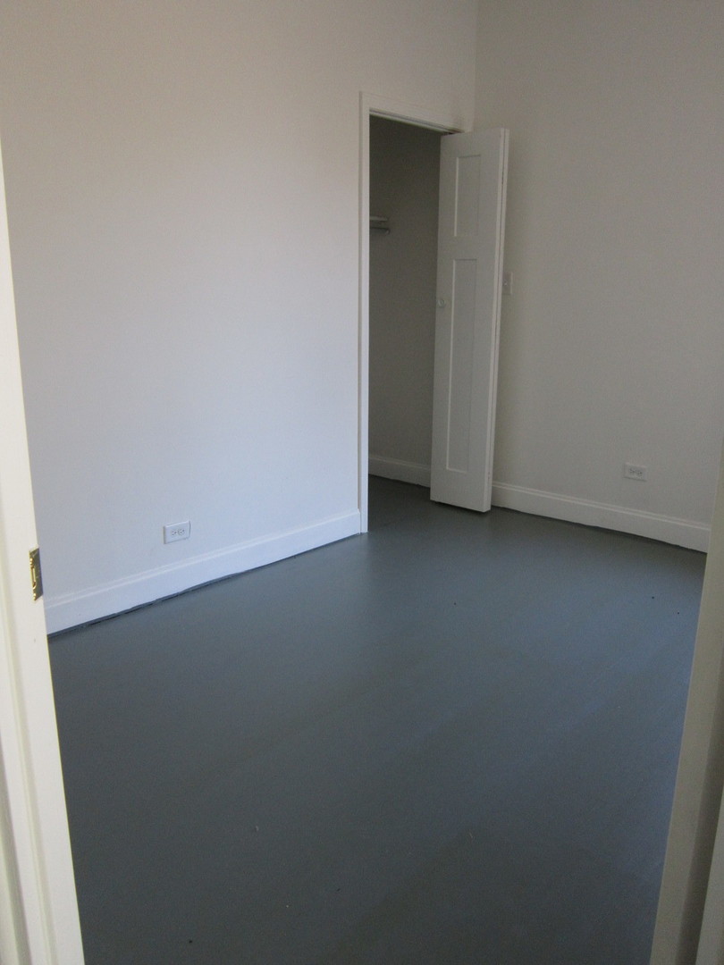 4035 West Harrison Street, Unit 1 Chicago, IL 60624 - Photo 12 of 12 a view of an empty room