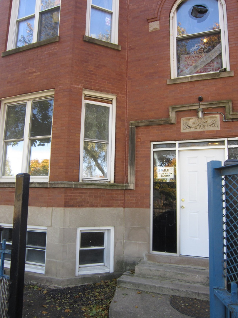 4035 West Harrison Street, Unit 1 Chicago, IL 60624 - Photo 2 of 12 a view of a brick building with many windows