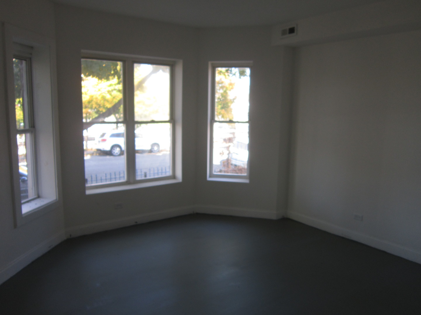 4035 West Harrison Street, Unit 1 Chicago, IL 60624 - Photo 5 of 12 an empty room with a window