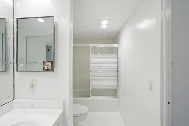 a bathroom with a bathtub and a toilet