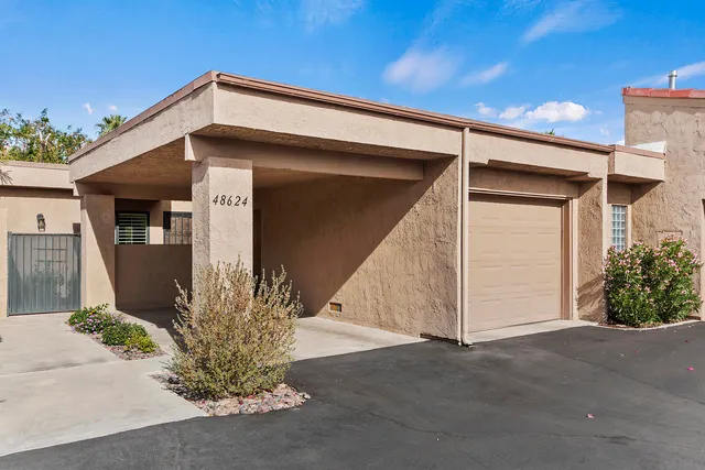 a view of a building with a garage