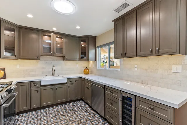 a kitchen with a sink and stove