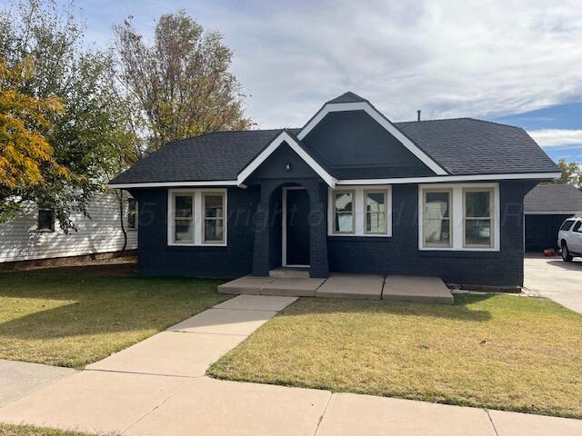 4233 Southwest 13th Avenue Amarillo, TX 79106 - Photo 1 of 55 a front view of a house with a garden and yard
