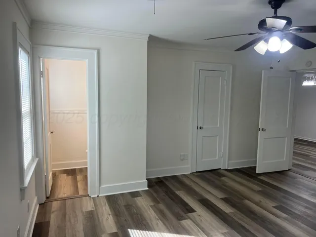 a view of a livingroom with wooden floor