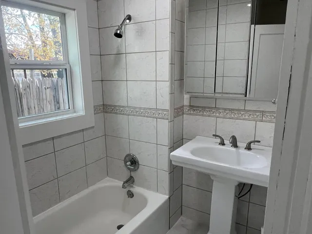 a bathroom with a sink and a bathtub