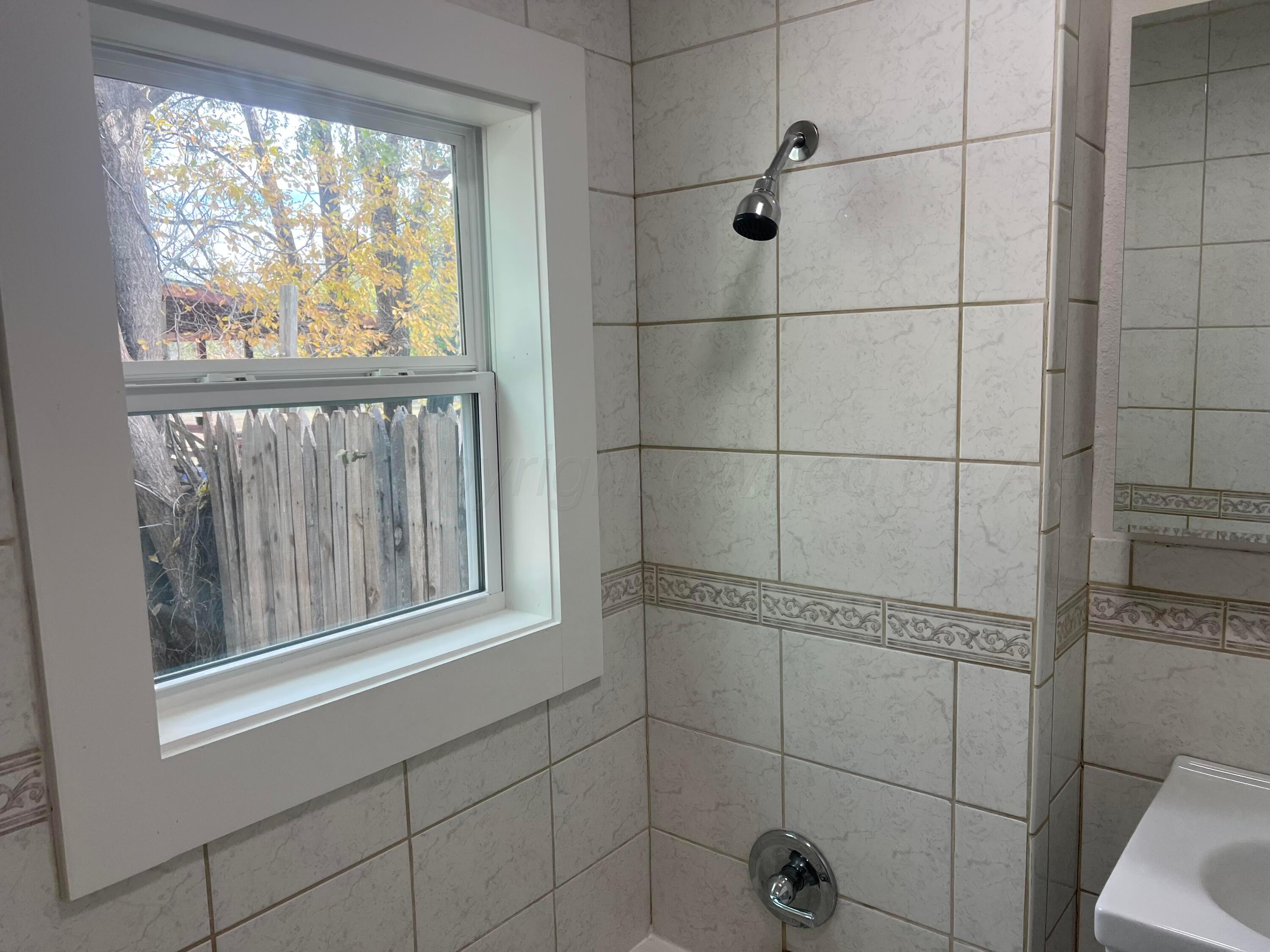 4233 Southwest 13th Avenue Amarillo, TX 79106 - Photo 22 of 55 a bathroom with a window