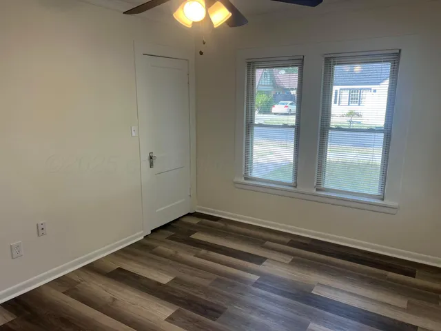 a view of a livingroom with wooden floor