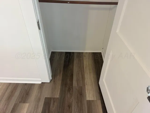 a kitchen with granite countertop a stove and a microwave