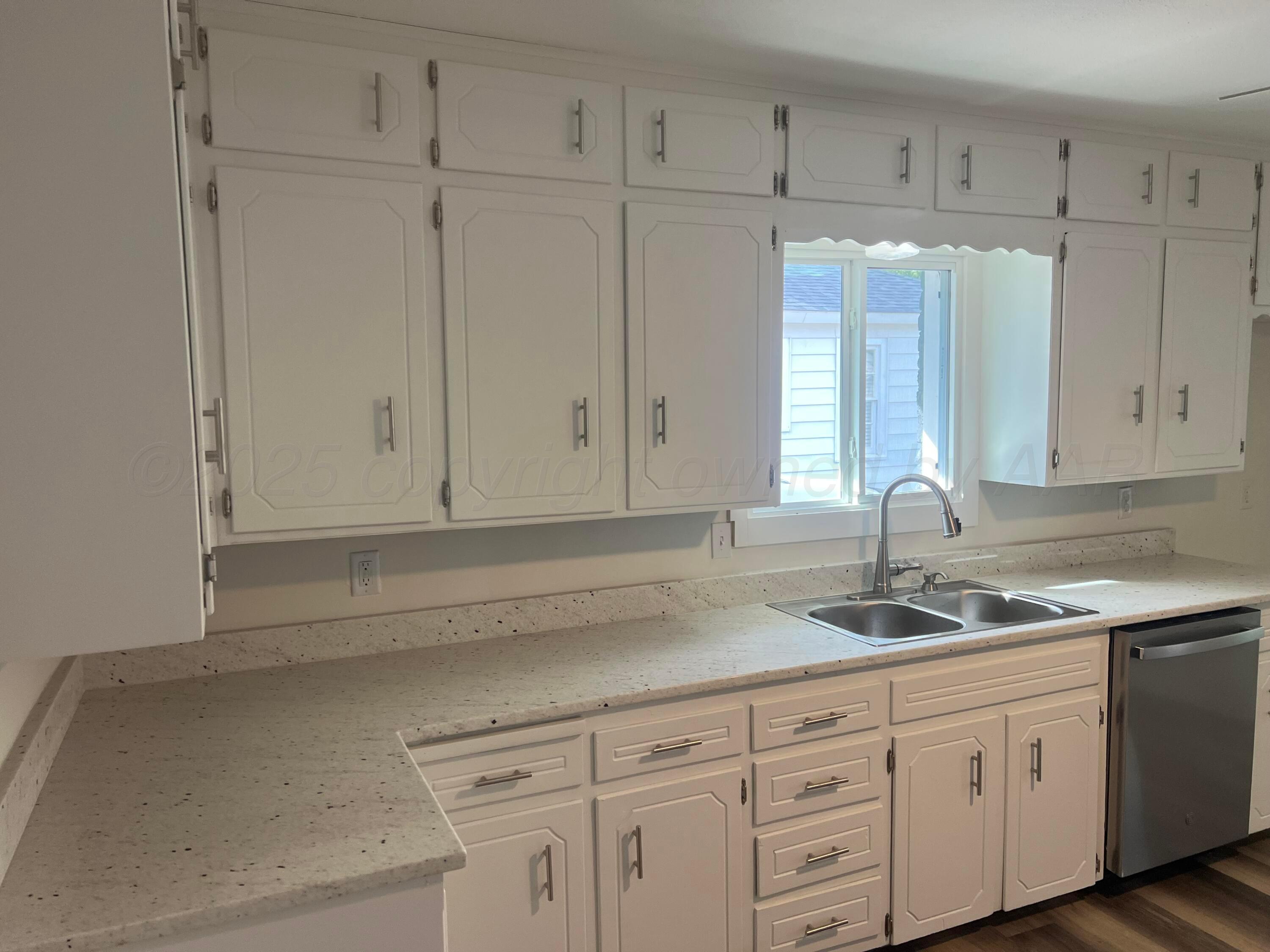 4233 Southwest 13th Avenue Amarillo, TX 79106 - Photo 34 of 55 a kitchen with white cabinets