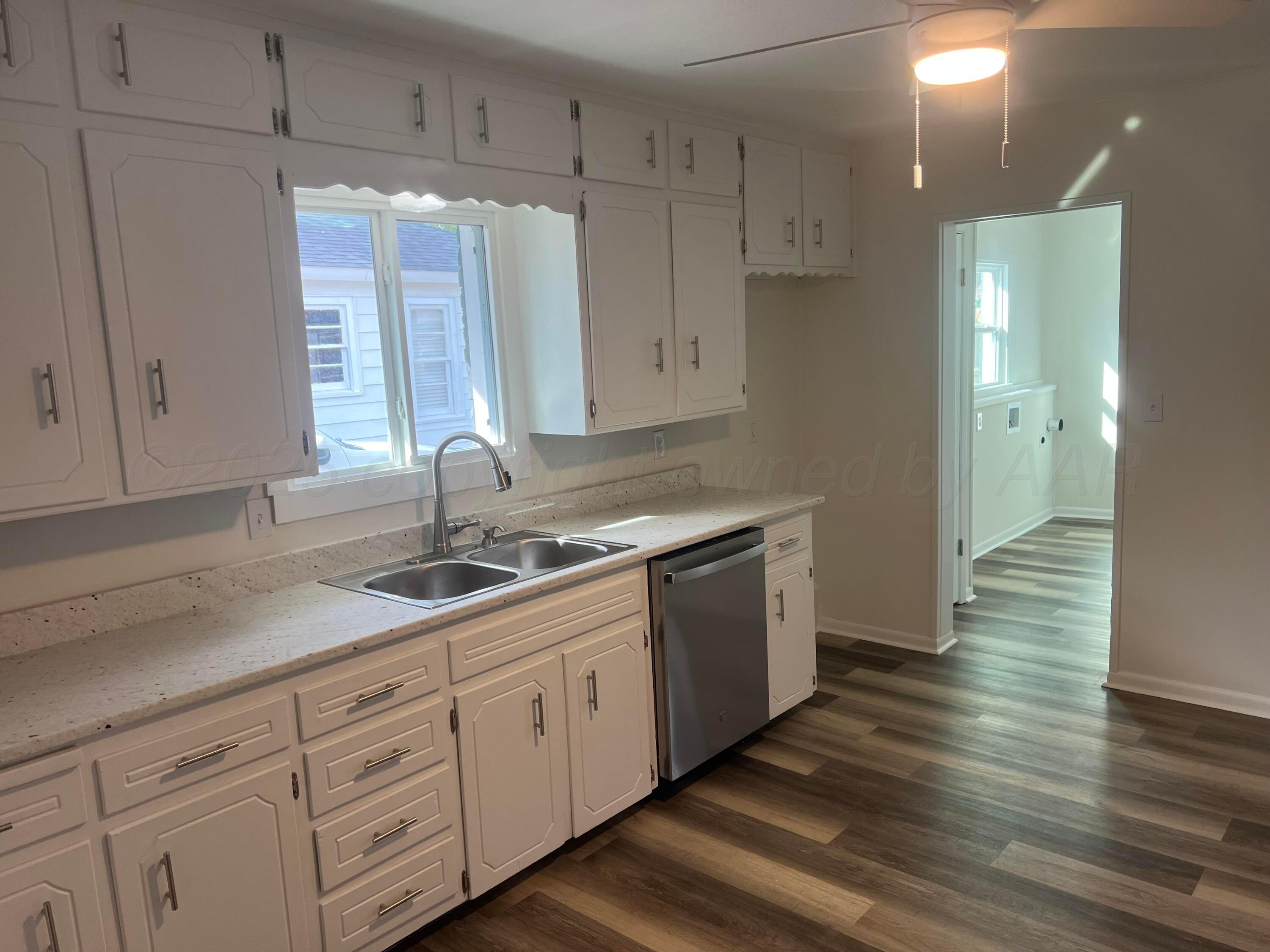 4233 Southwest 13th Avenue Amarillo, TX 79106 - Photo 35 of 55 a kitchen with sink and cabinets