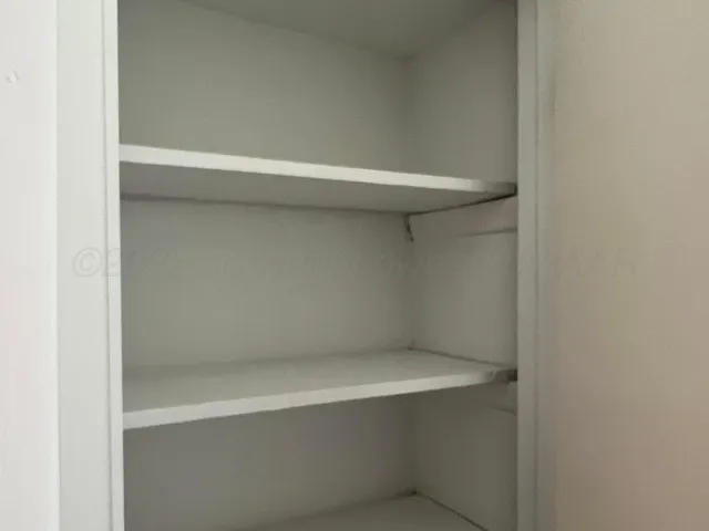 a view of a house with a door and wooden floor