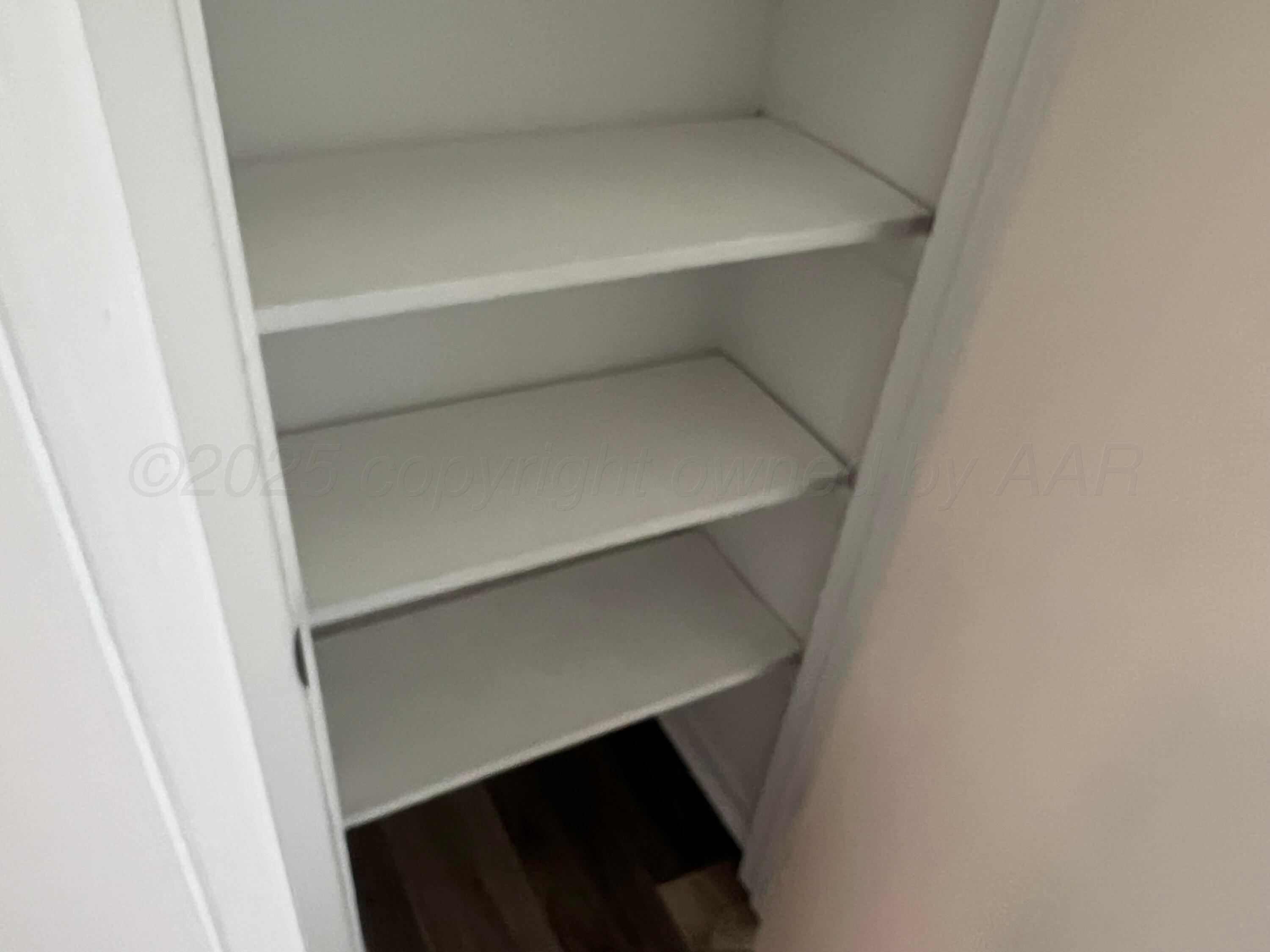 4233 Southwest 13th Avenue Amarillo, TX 79106 - Photo 44 of 55 a storage room with an empty shelf