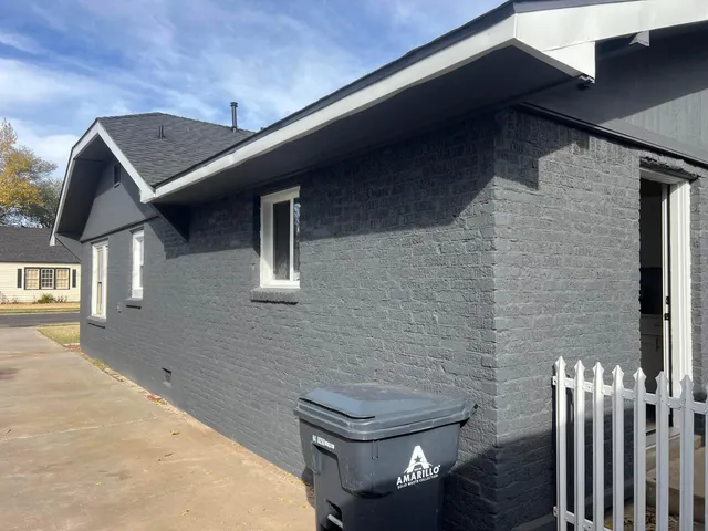 a view of a backyard of the house