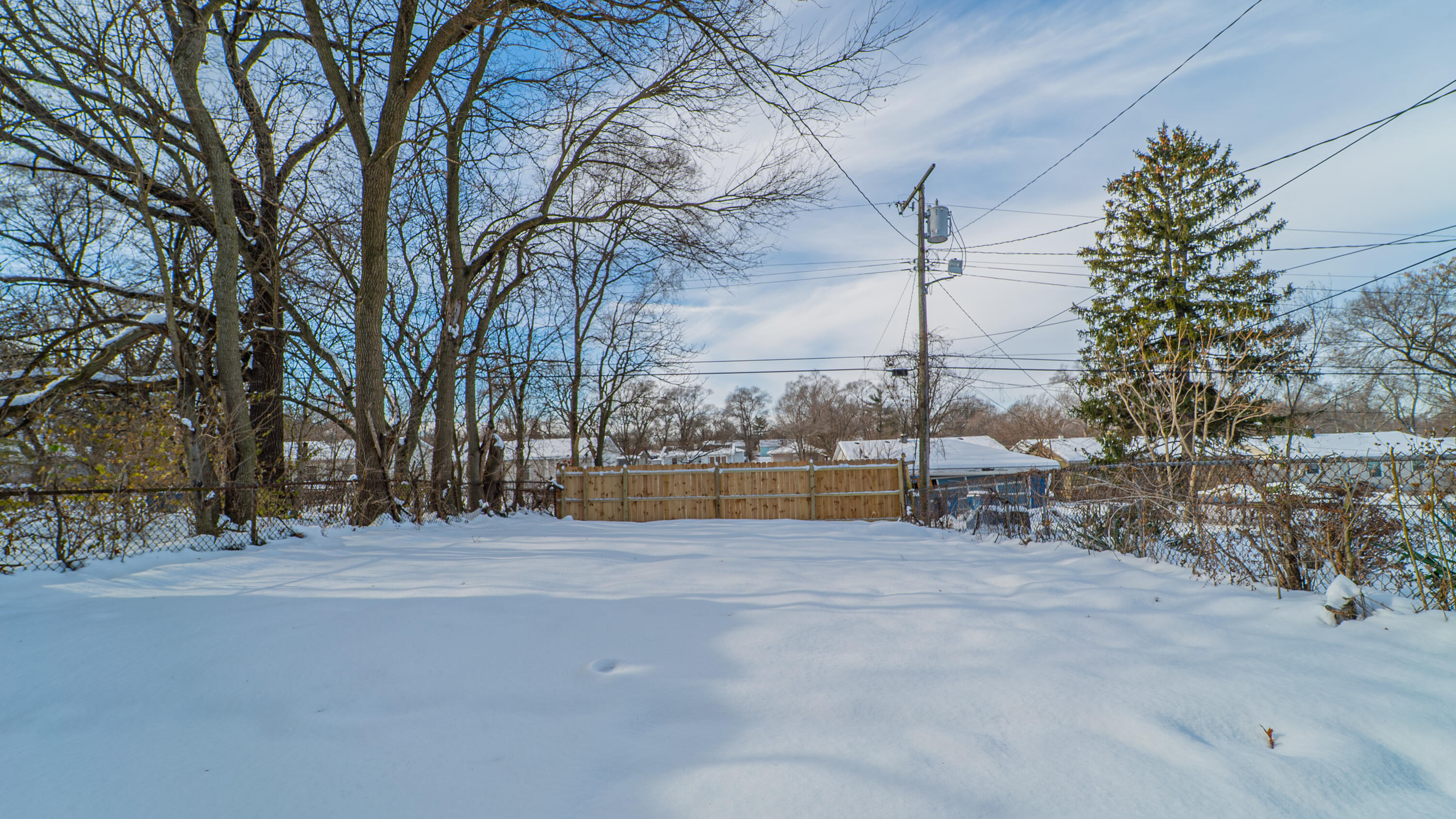 4044 Louisiana Street Gary, IN 46409 - Photo 31 of 31 a view of a house with a snow in a yard