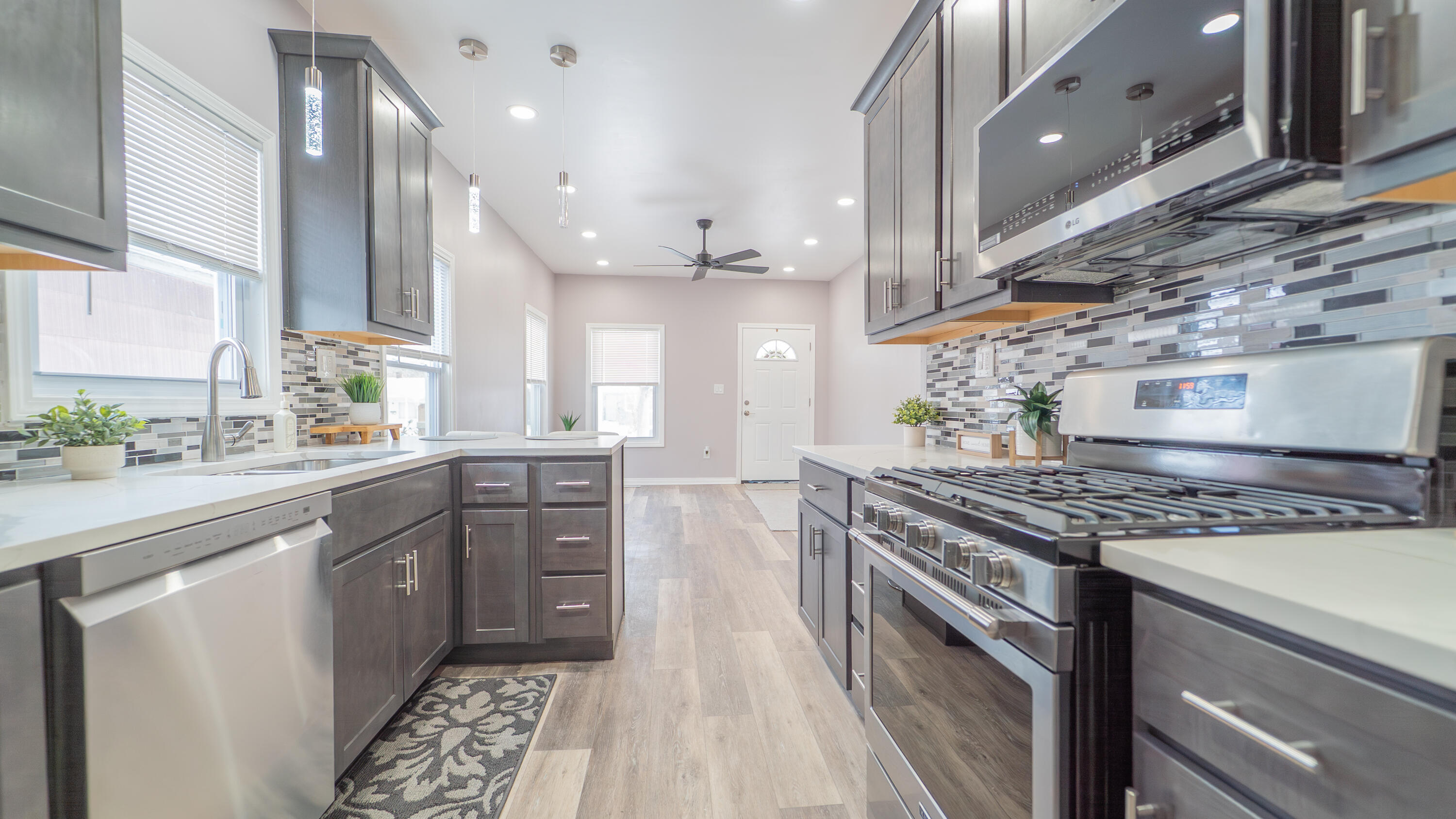 4044 Louisiana Street Gary, IN 46409 - Photo 9 of 31 a kitchen with stainless steel appliances granite countertop a stove a sink dishwasher and a refrigerator