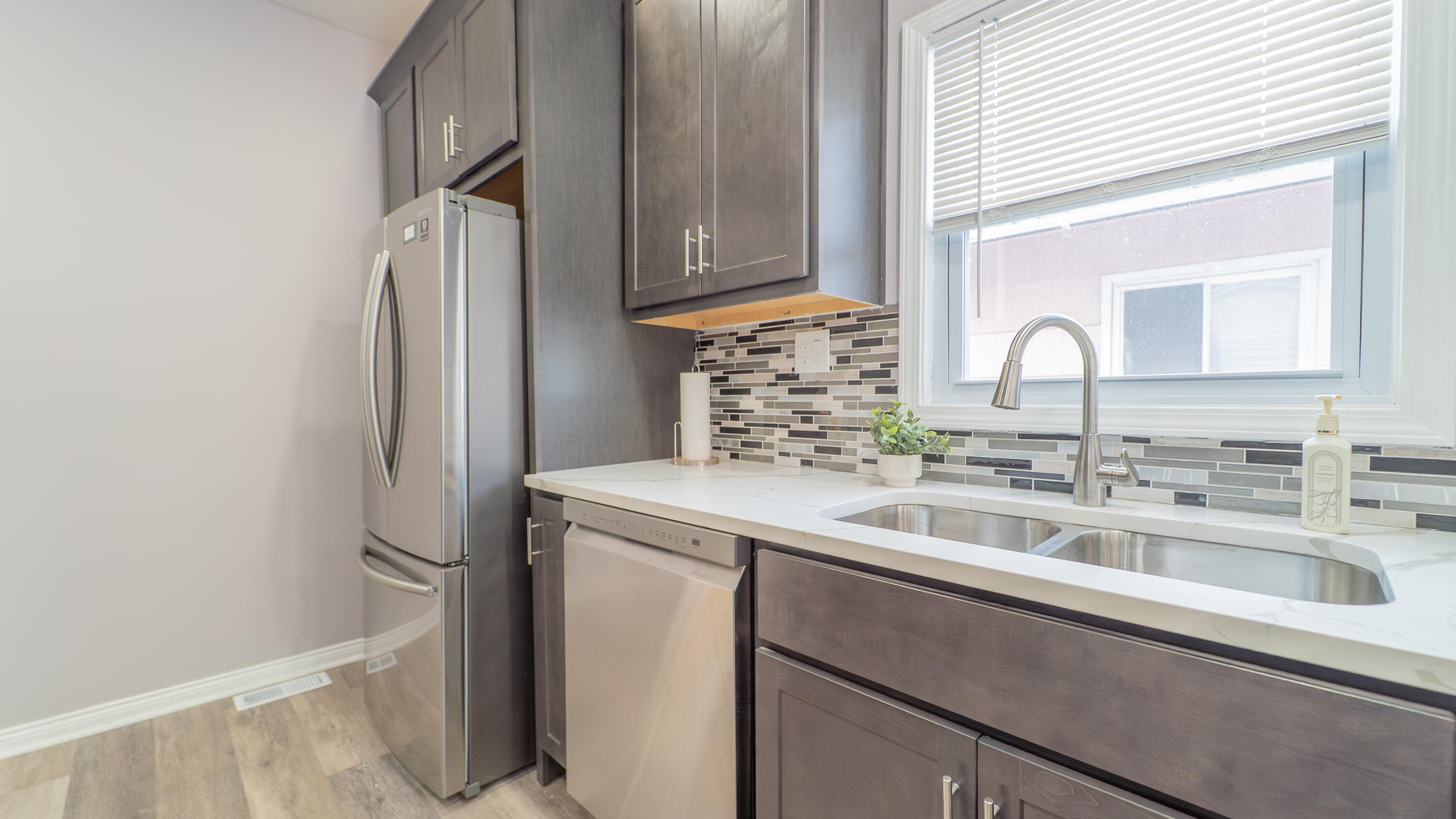 4044 Louisiana Street Gary, IN 46409 - Photo 10 of 31 a kitchen with a sink and a refrigerator