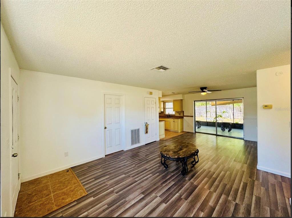 7423 Mohawk Trail Spring Hill, FL 34606 - Photo 19 of 20 a view of a living room and wooden floor