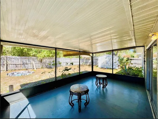 a view of a room with large windows