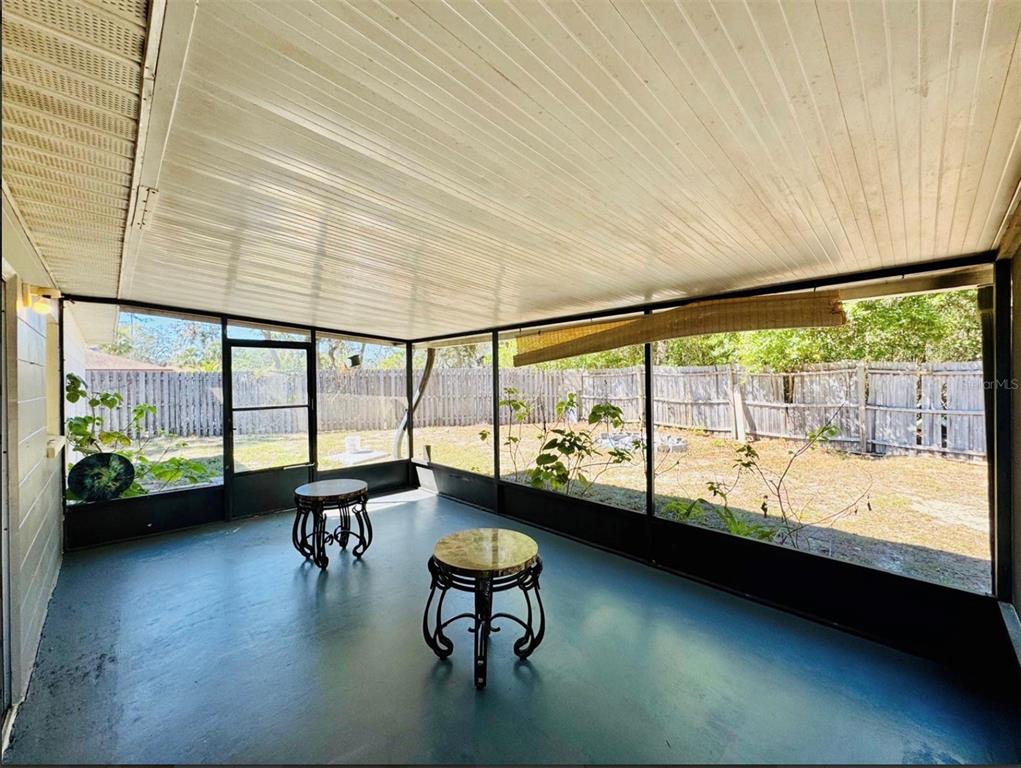 7423 Mohawk Trail Spring Hill, FL 34606 - Photo 5 of 20 a living room with furniture and a large window