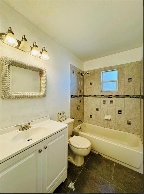 7423 Mohawk Trail Spring Hill, FL 34606 - Photo 6 of 20 a bathroom with a sink toilet and shower