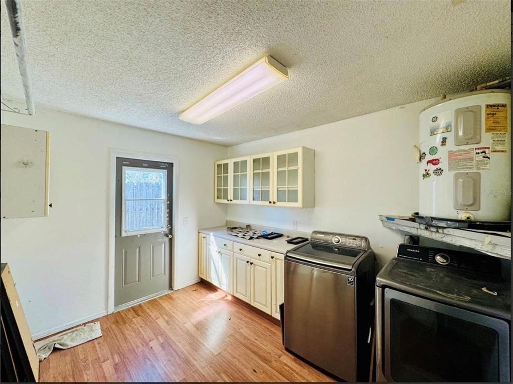 7423 Mohawk Trail Spring Hill, FL 34606 - Photo 8 of 20 a kitchen with stainless steel appliances granite countertop a stove and a refrigerator