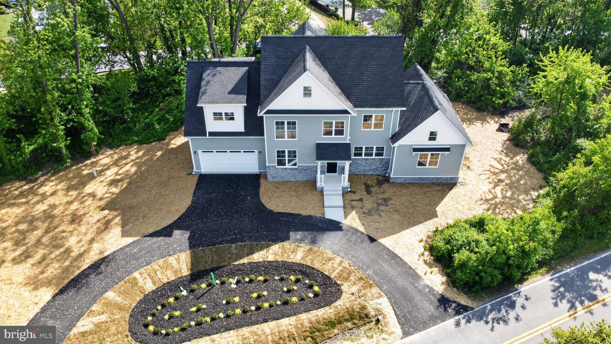 2001 Poplar Ridge Road Pasadena, MD 21122 - Photo 4 of 83 a front view of a house with garden