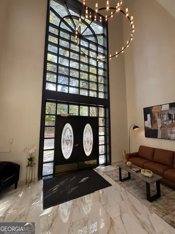 a view of a hallway with couch and wooden floor
