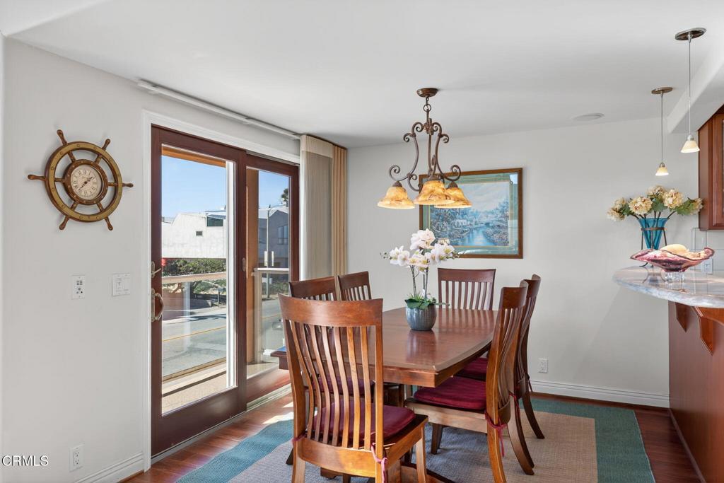 2408 Ocean Drive Oxnard, CA 93035 - Photo 14 of 58 a view of a dining room with furniture window and wooden floor