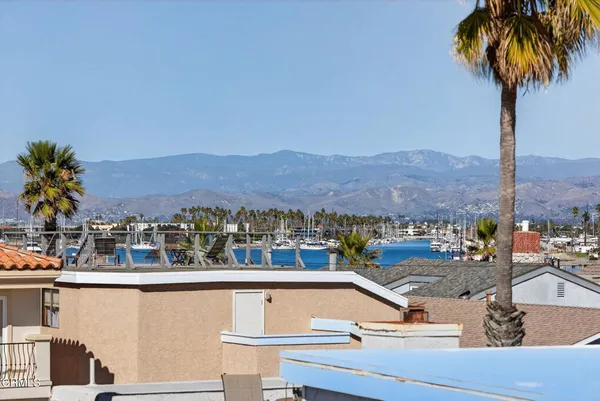 a room with pool table and windows