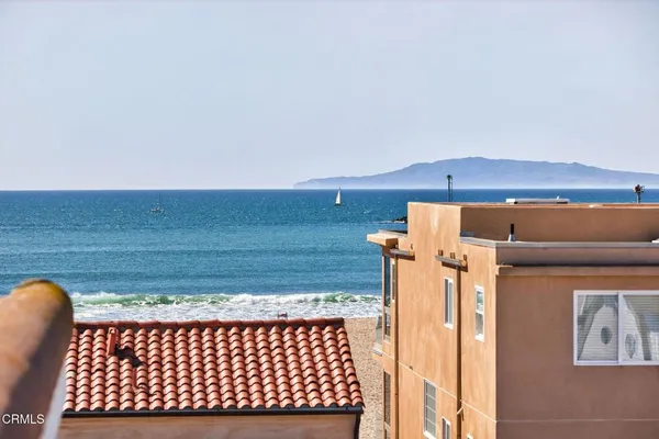 a bathroom with a granite countertop sink a toilet a mirror and shower