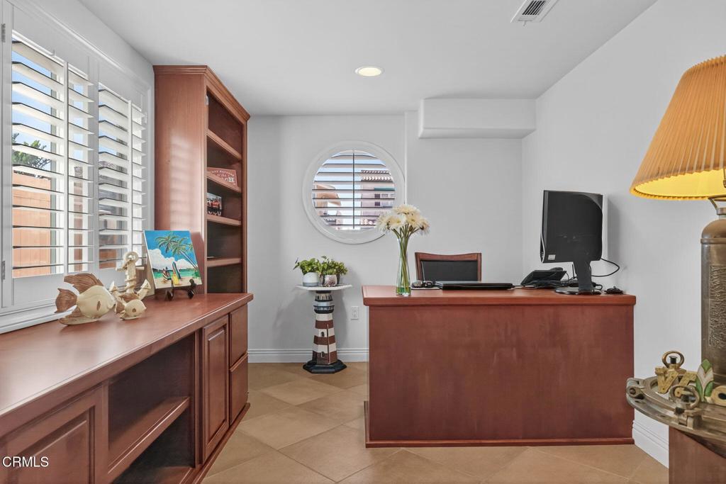 2408 Ocean Drive Oxnard, CA 93035 - Photo 41 of 58 a room with cabinets and window