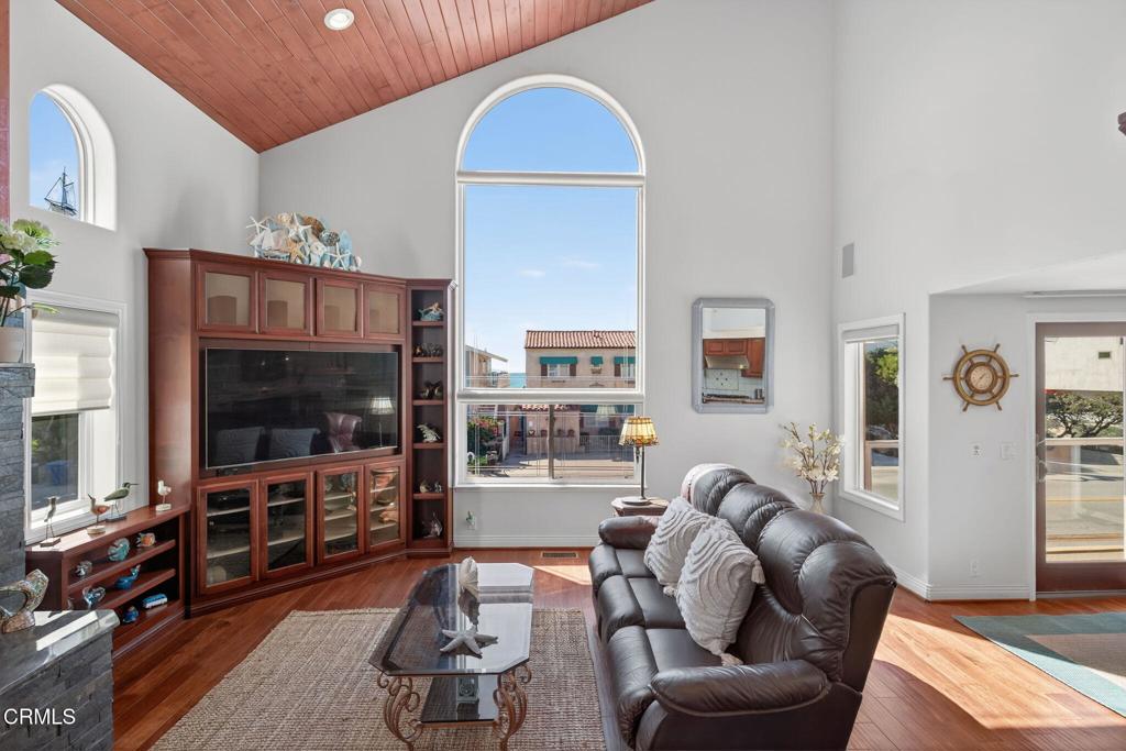 2408 Ocean Drive Oxnard, CA 93035 - Photo 8 of 58 a living room with furniture and a flat screen tv