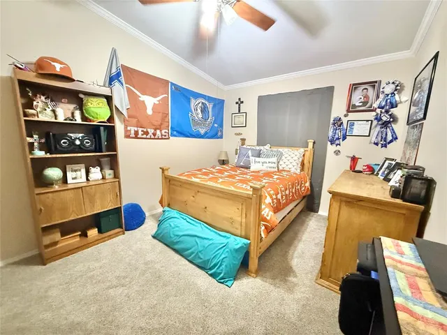 a bedroom with a bed and with on the wall in it