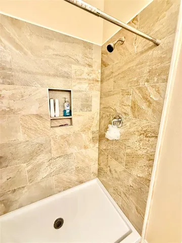 a bathroom with a bath tub