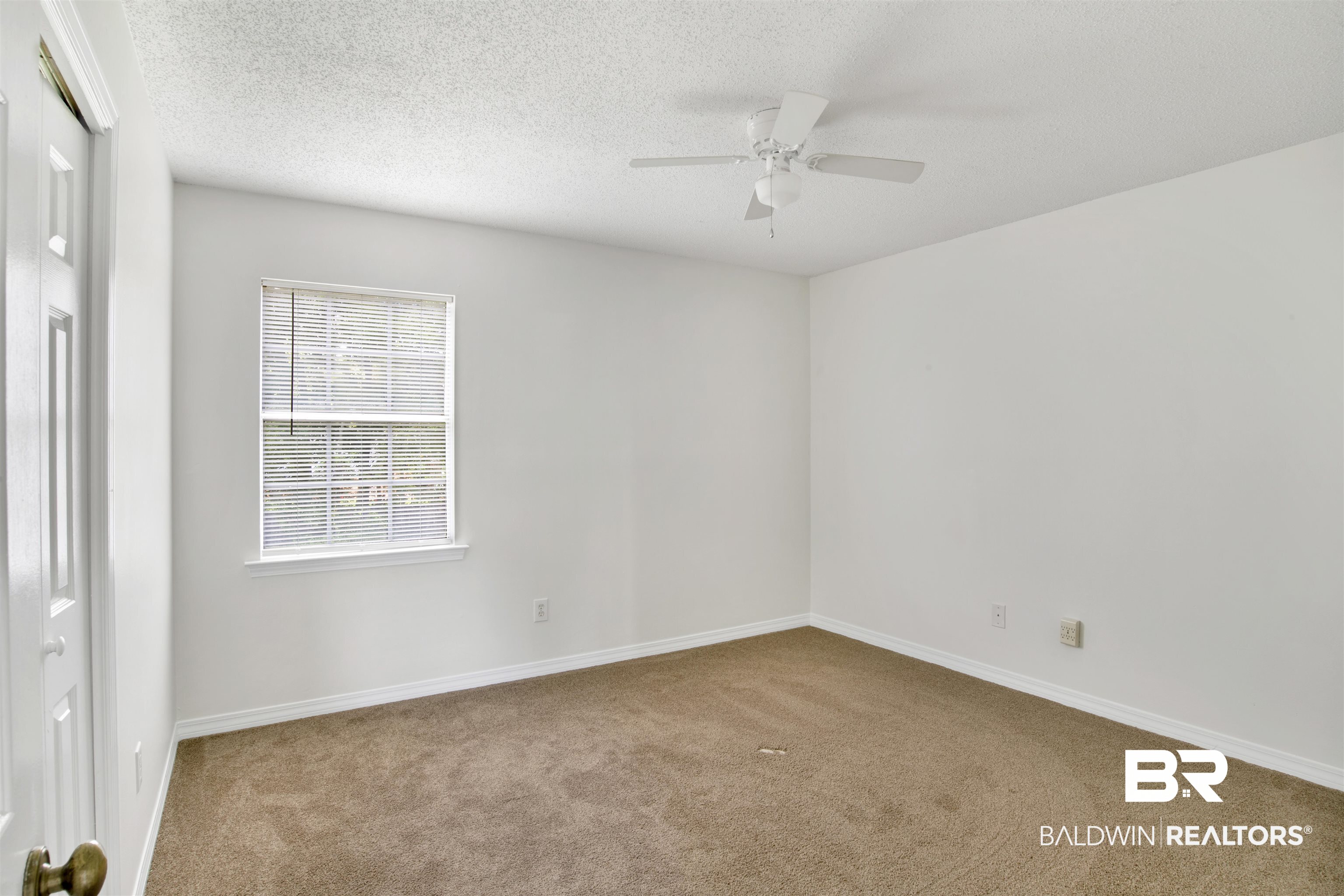 5480 Country Club Boulevard Theodore, AL 36582 - Photo 26 of 36 Spare room featuring ceiling fan, a textured ceiling, and carpet floors