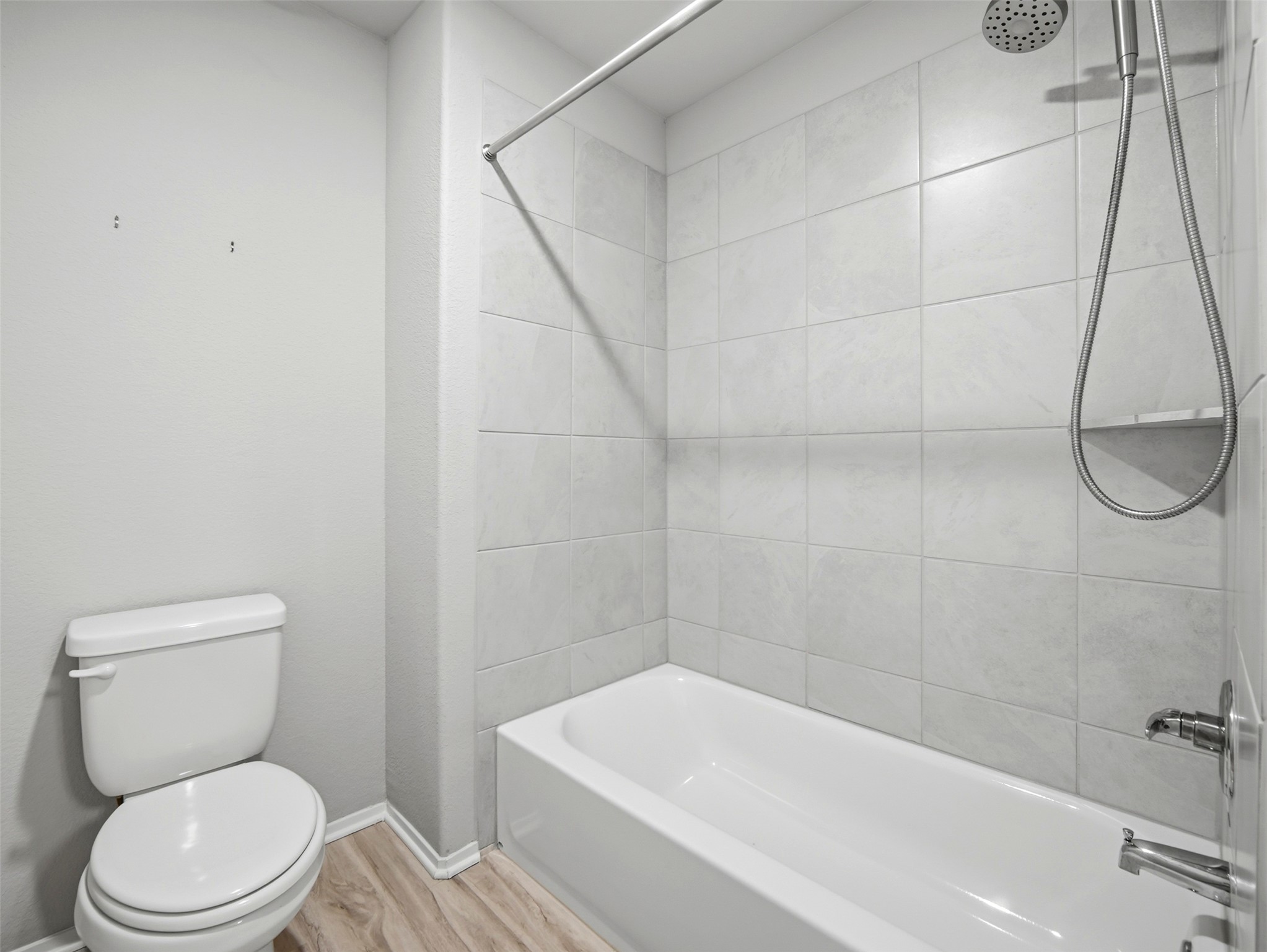 60 Bent Trl Lane Georgetown, TX 78628 - Photo 33 of 40 A well-appointed bathroom featuring a clean tub and shower combination with stylish tile surround.